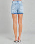 Light blue denim shorts worn by a person on a gray background