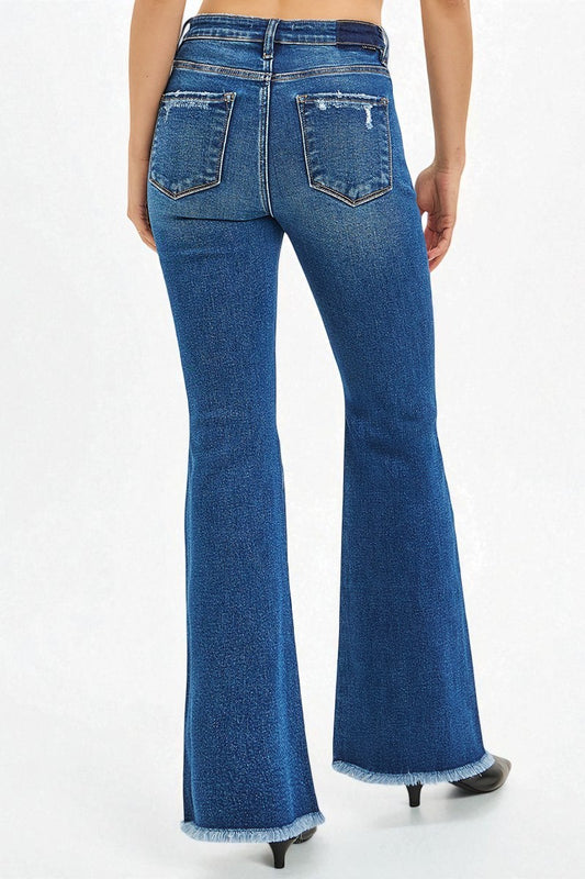 Blue jeans worn by a person on a white background