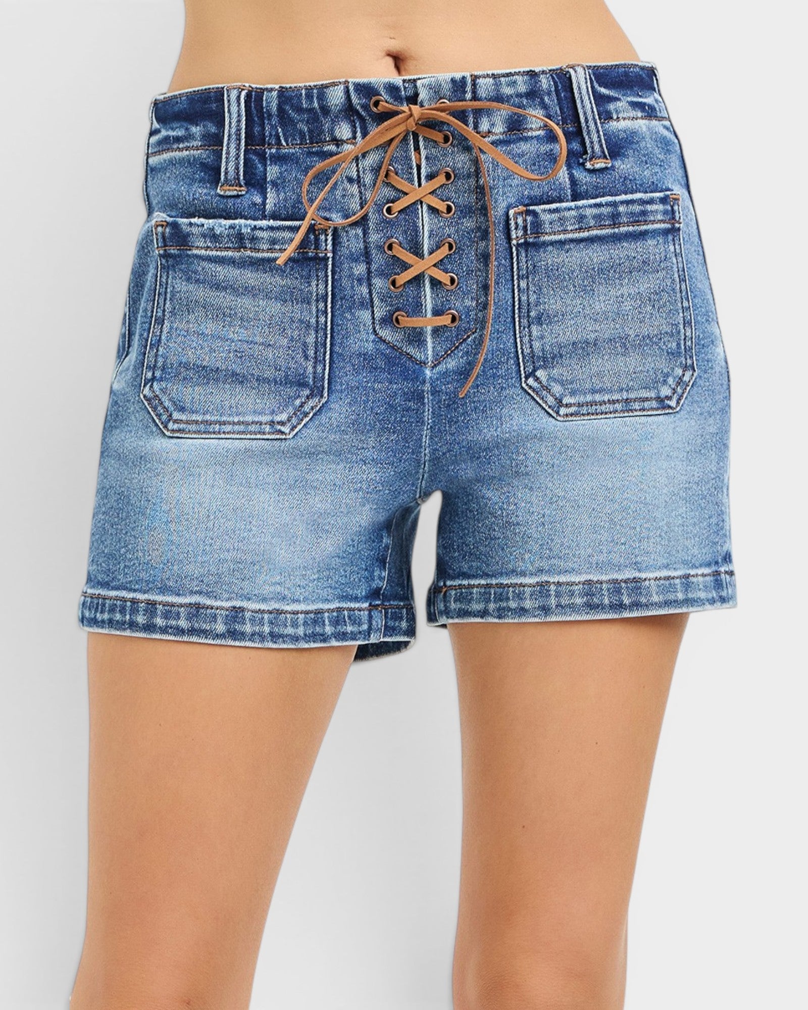 Blue denim shorts with lace-up front on a white background