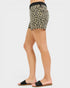 Leopard print shorts worn by a person on a white background