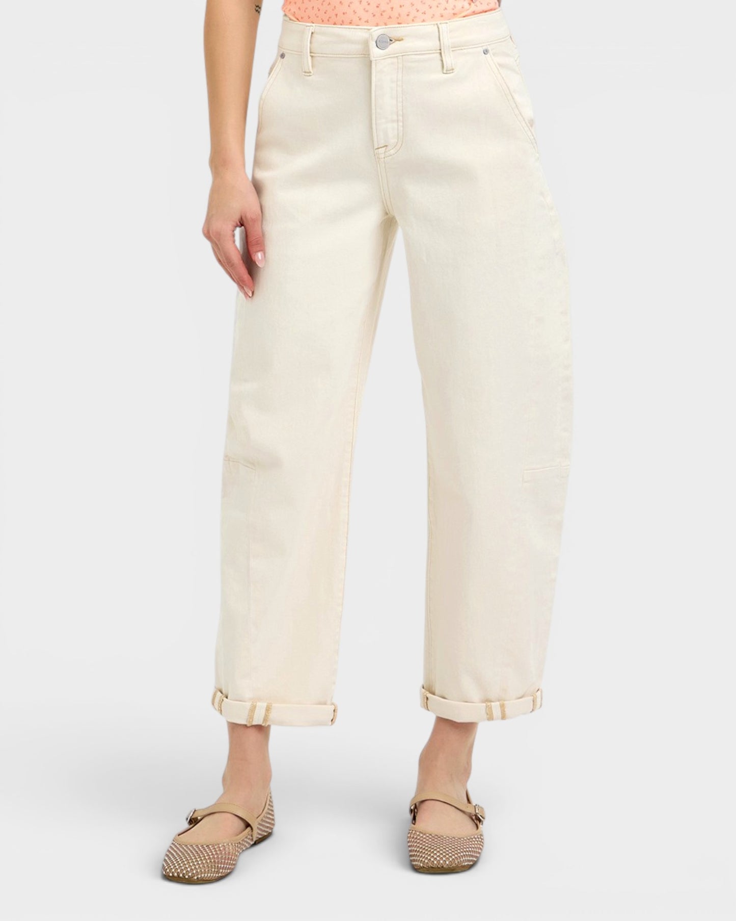 Person wearing light-colored jeans on a white background