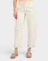 Person wearing light-colored jeans on a white background