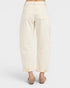 White pants worn by a person on a white background