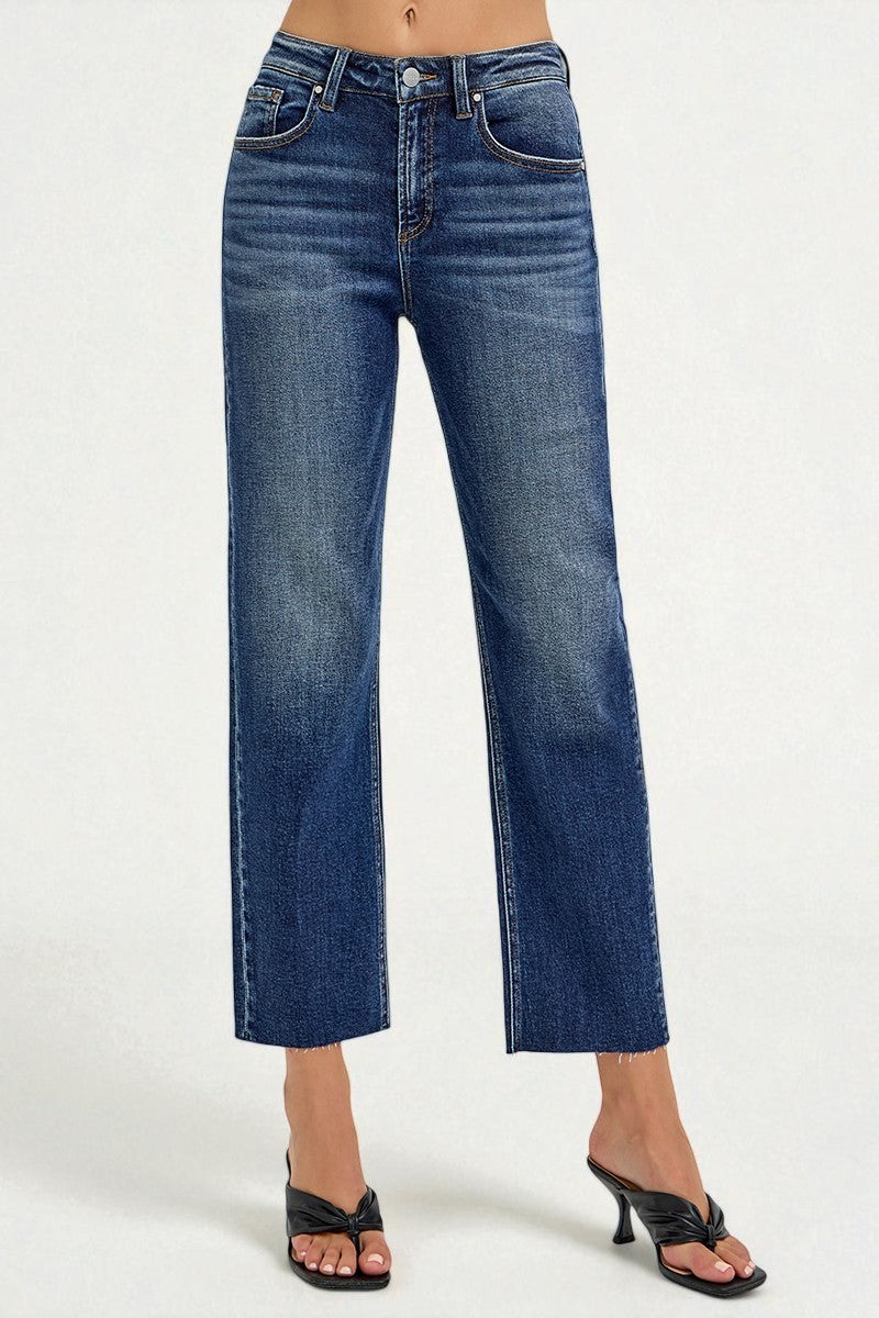 Blue jeans worn by a person on a white background