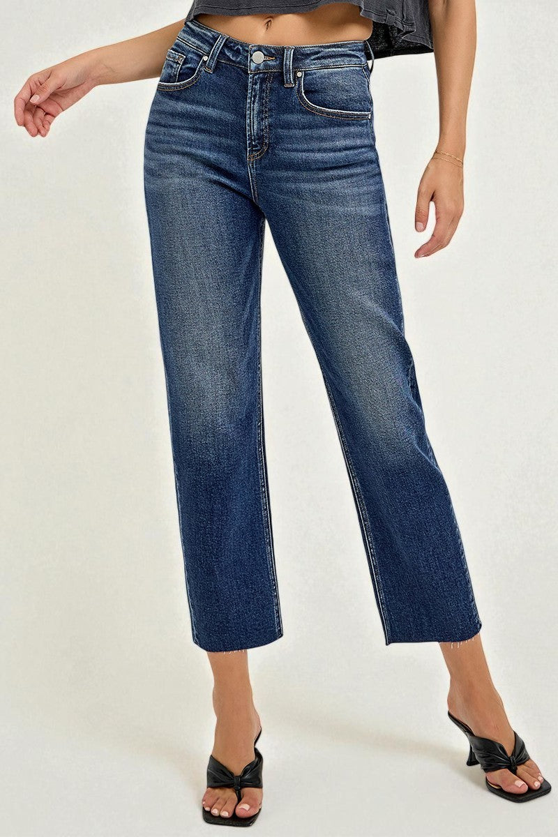 Person wearing blue jeans on a white background