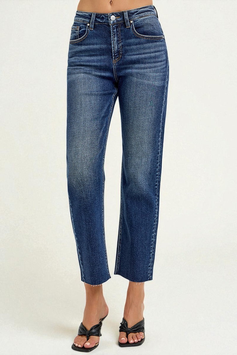 Blue jeans worn by a person on a white background