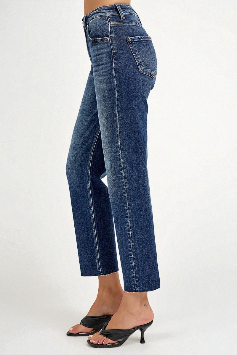 Blue jeans worn by a person on a white background