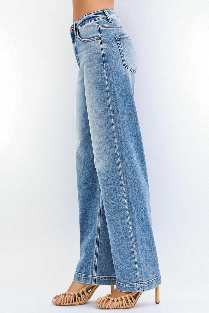 Light blue jeans worn by a person on a white background