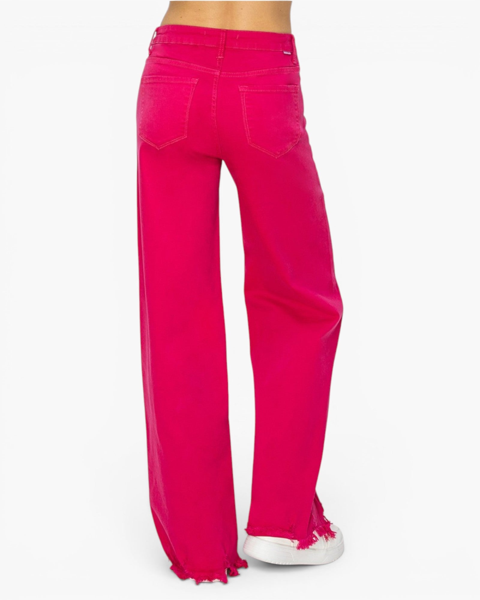 Bright pink wide-leg jeans with raw, frayed hems, shown from the back on a model against a white background.