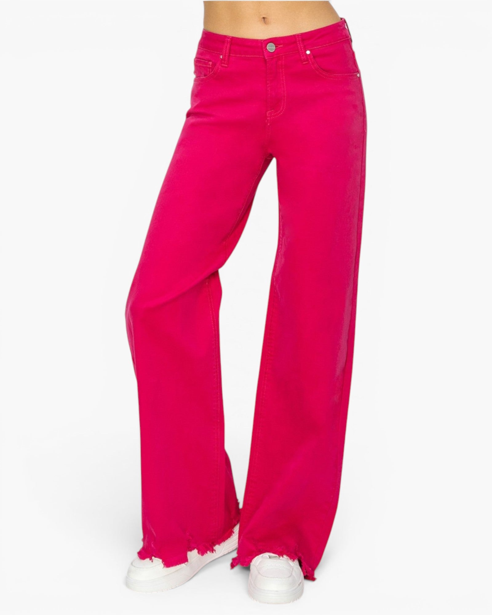 Bright pink wide-leg jeans with raw, frayed hems, shown on a model from the waist down wearing white sneakers against a plain white background.