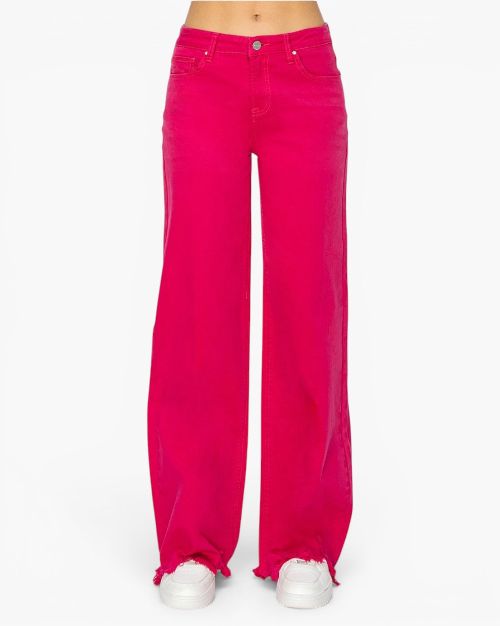 Bright pink wide-leg jeans with frayed hems, shown on a model from the waist down wearing white sneakers against a plain white background.