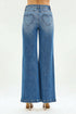 Blue jeans with heart-shaped cutouts on a white background