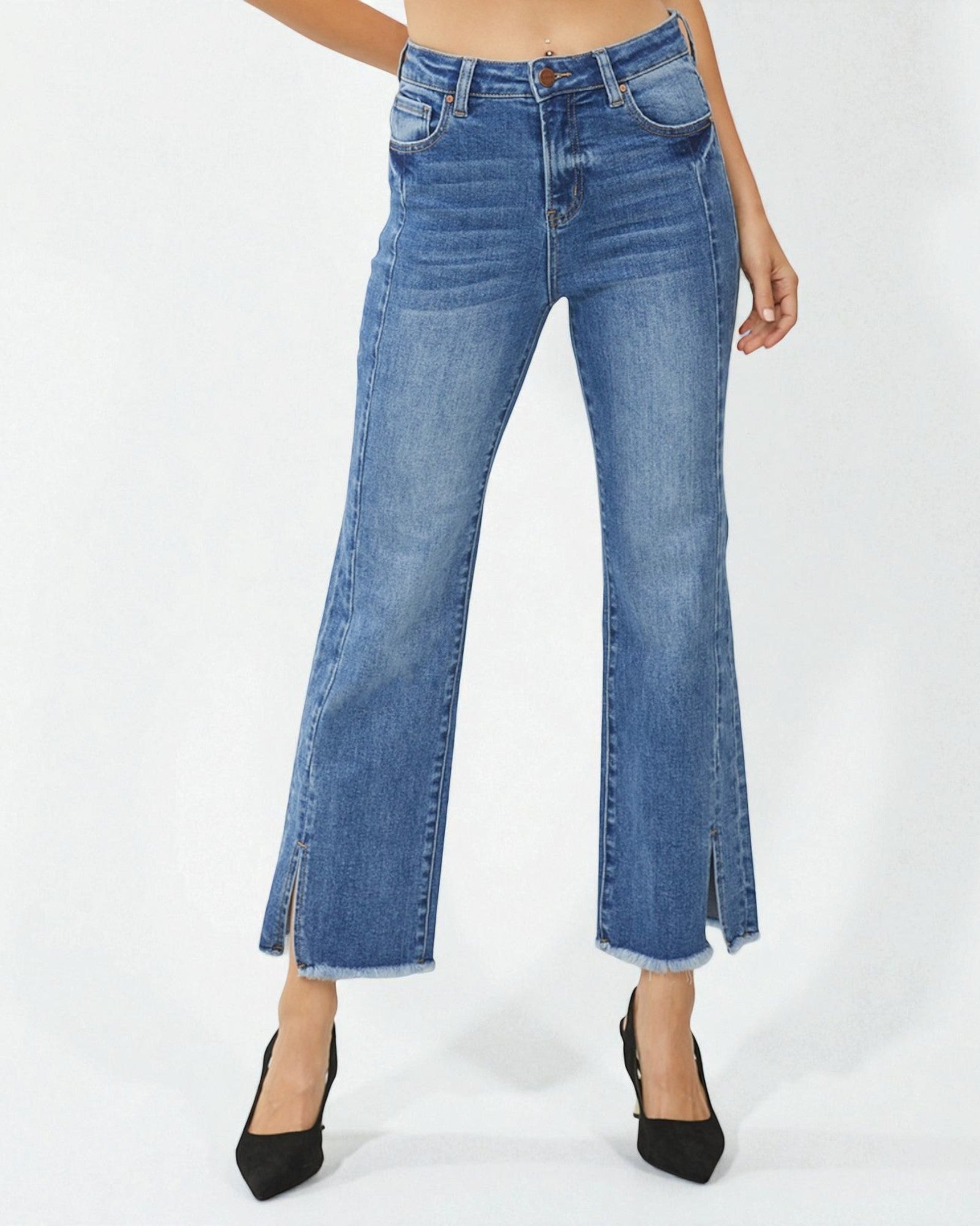 Blue jeans with a slit on a white background