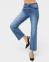 Blue jeans worn by a person on a white background