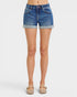 Denim shorts worn by a person on a white background