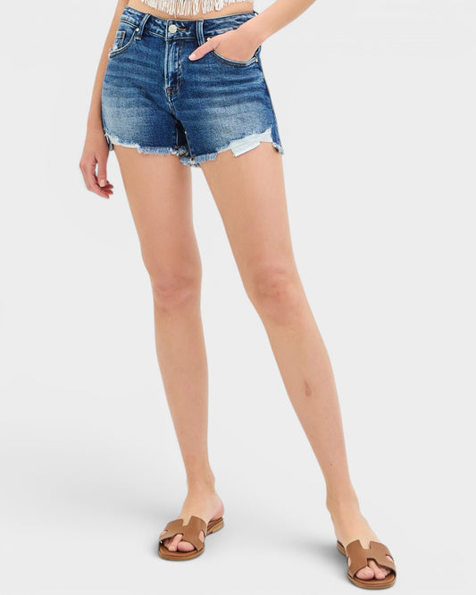 Person wearing denim shorts on a white background