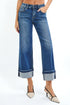 Person wearing blue jeans with a white background