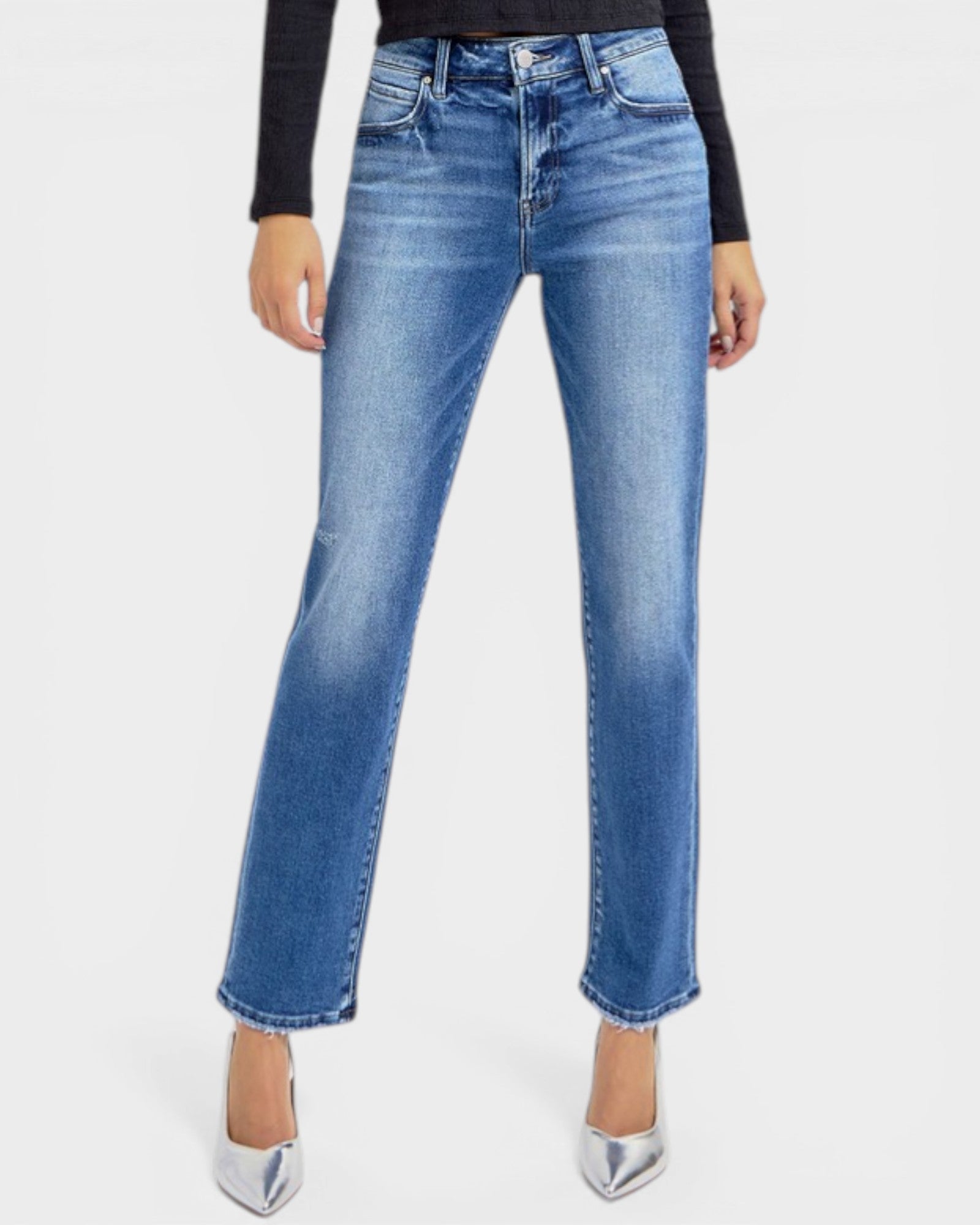Person wearing blue jeans on a white background