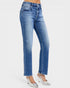 Blue jeans worn by a person on a white background