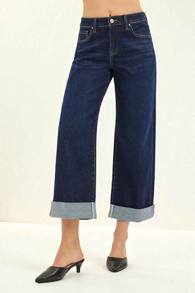 Dark blue wide-leg jeans on a plain background
