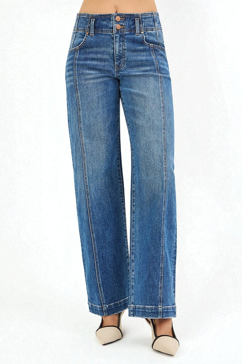 Blue jeans worn by a person on a white background