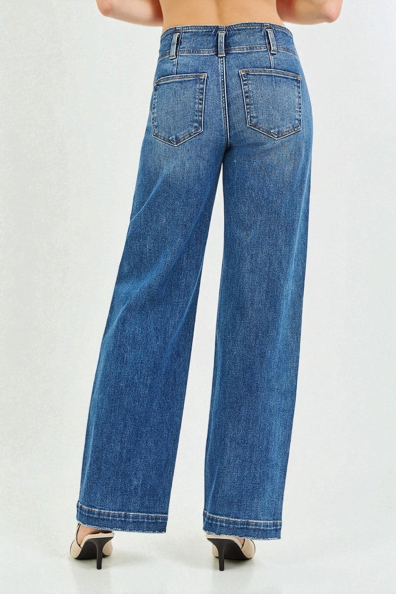 Blue jeans worn by a person on a white background