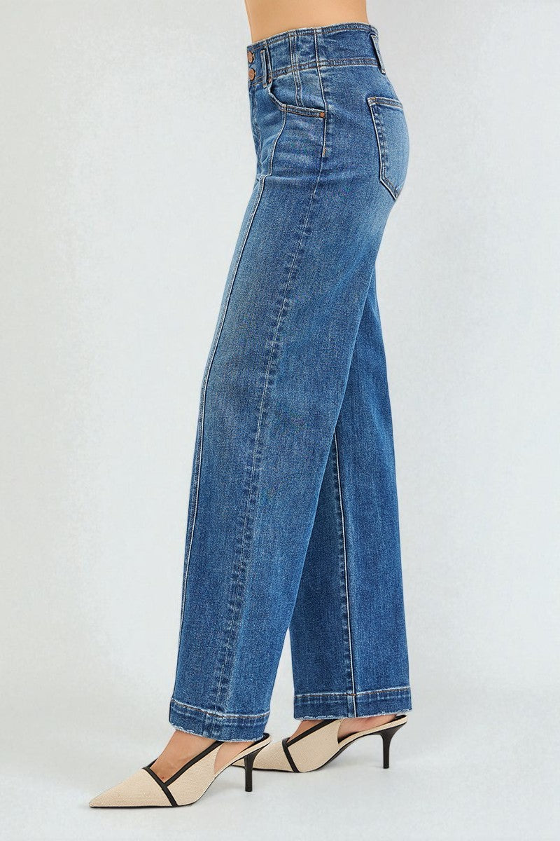 Blue jeans worn by a person on a white background
