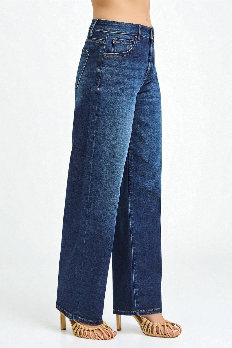 Blue jeans worn by a person on a white background