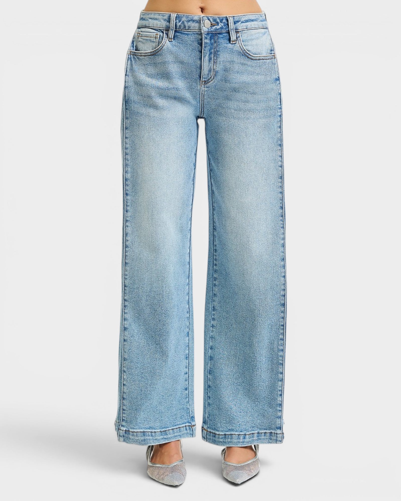 Light blue jeans worn by a person on a white background