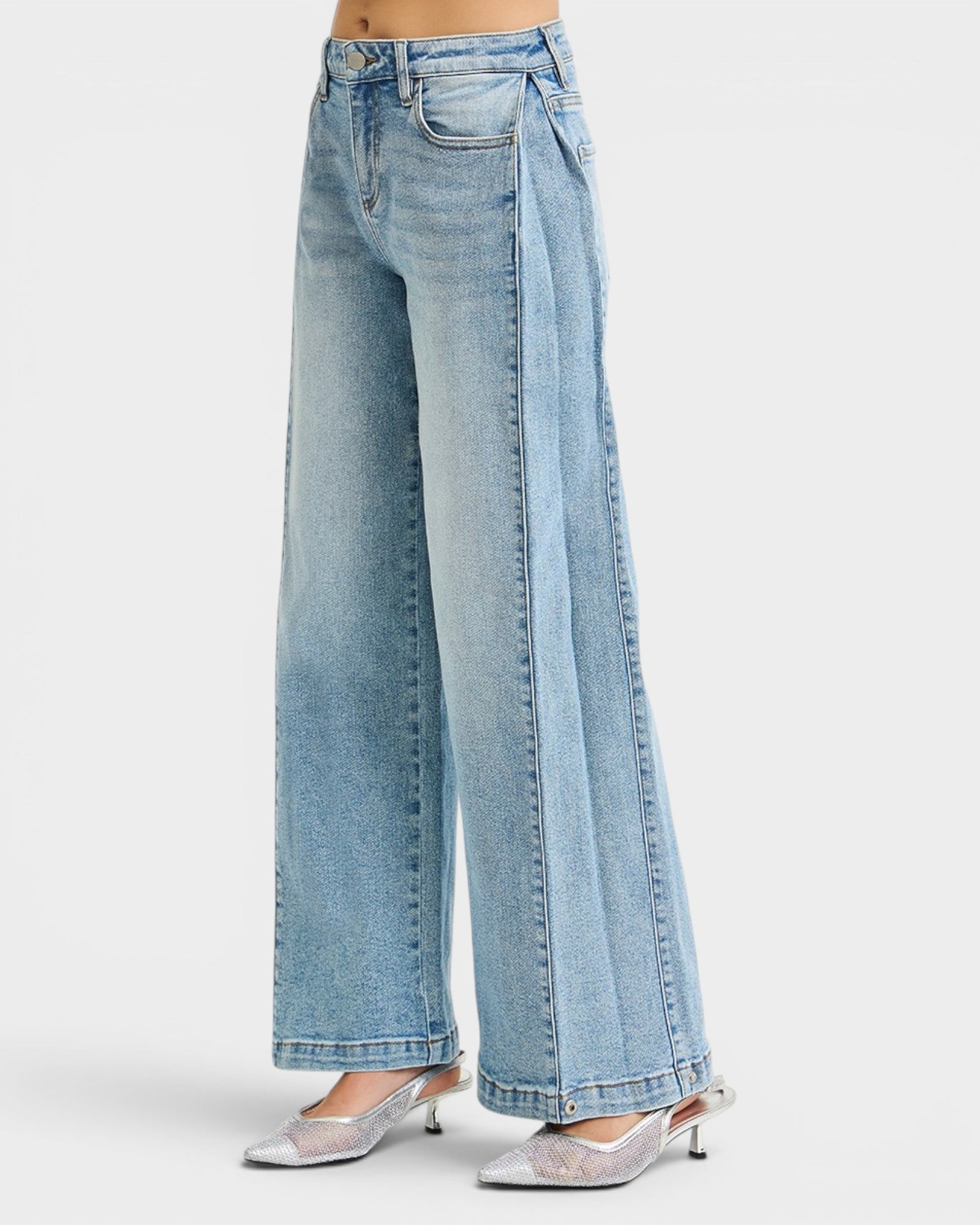 Light blue jeans worn by a person on a white background