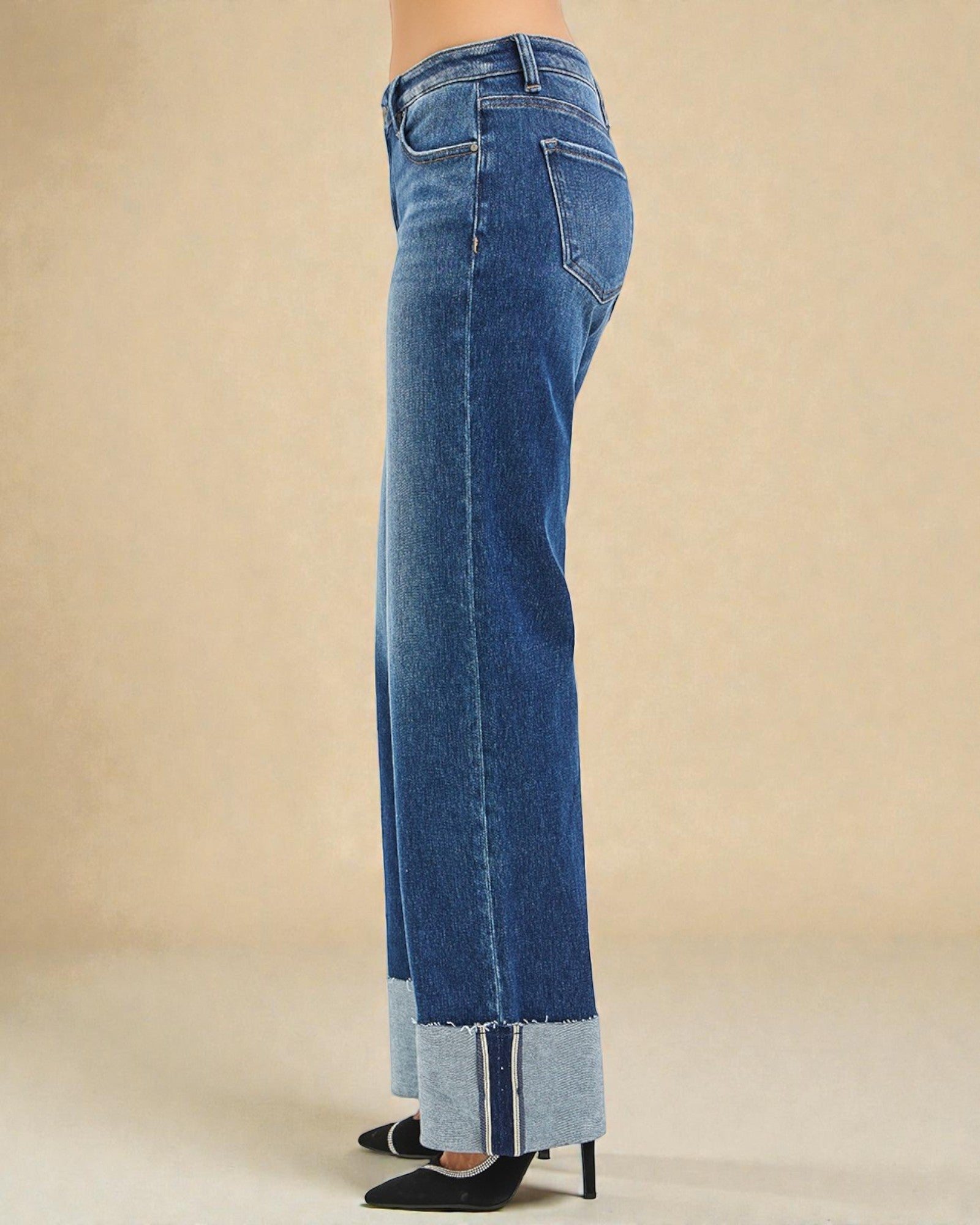 Blue jeans with a beige background