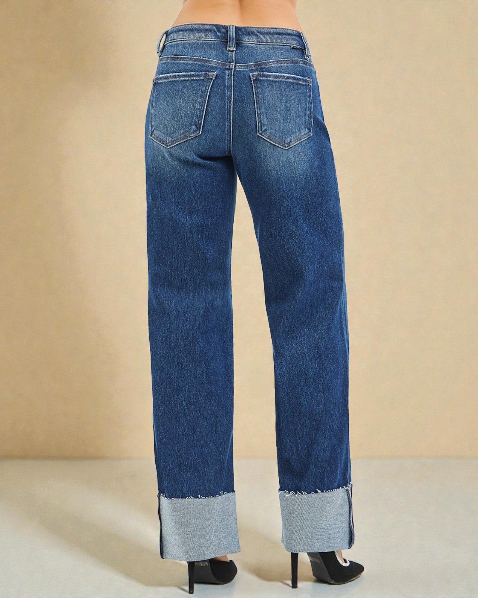 Blue jeans with a beige background