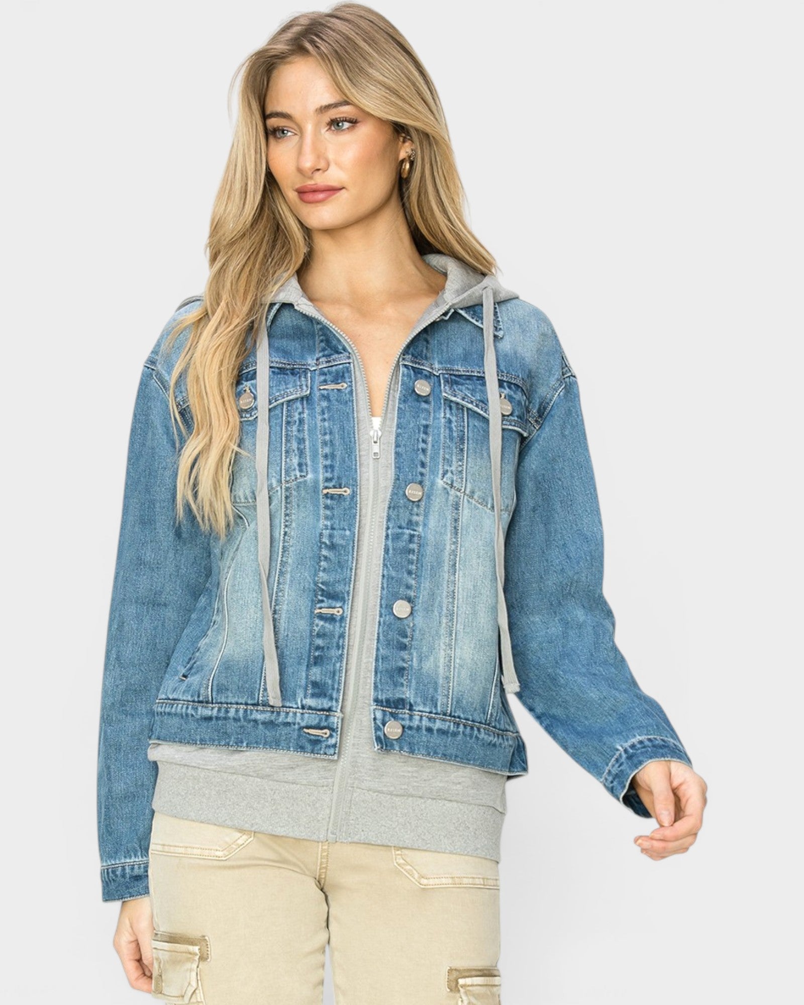 Woman wearing a blue denim jacket on a white background