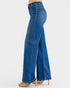 Blue jeans with a slit on a white background