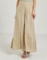 Beige wide-leg pants worn by a person on a white background