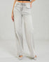 Light blue jeans worn by a person on a plain background