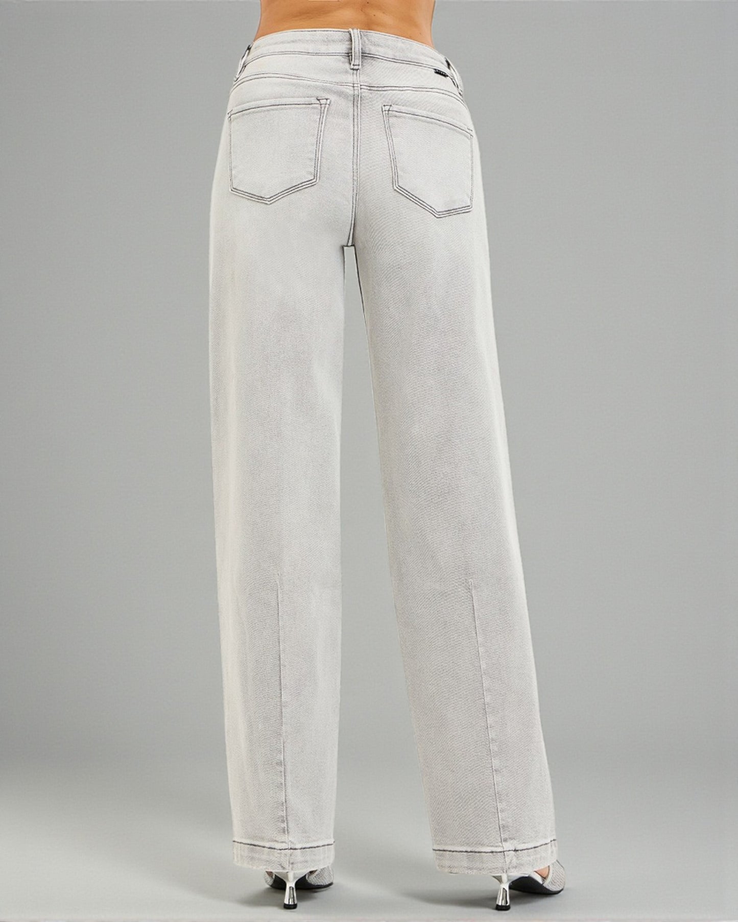 Light gray wide-leg jeans on a gray background