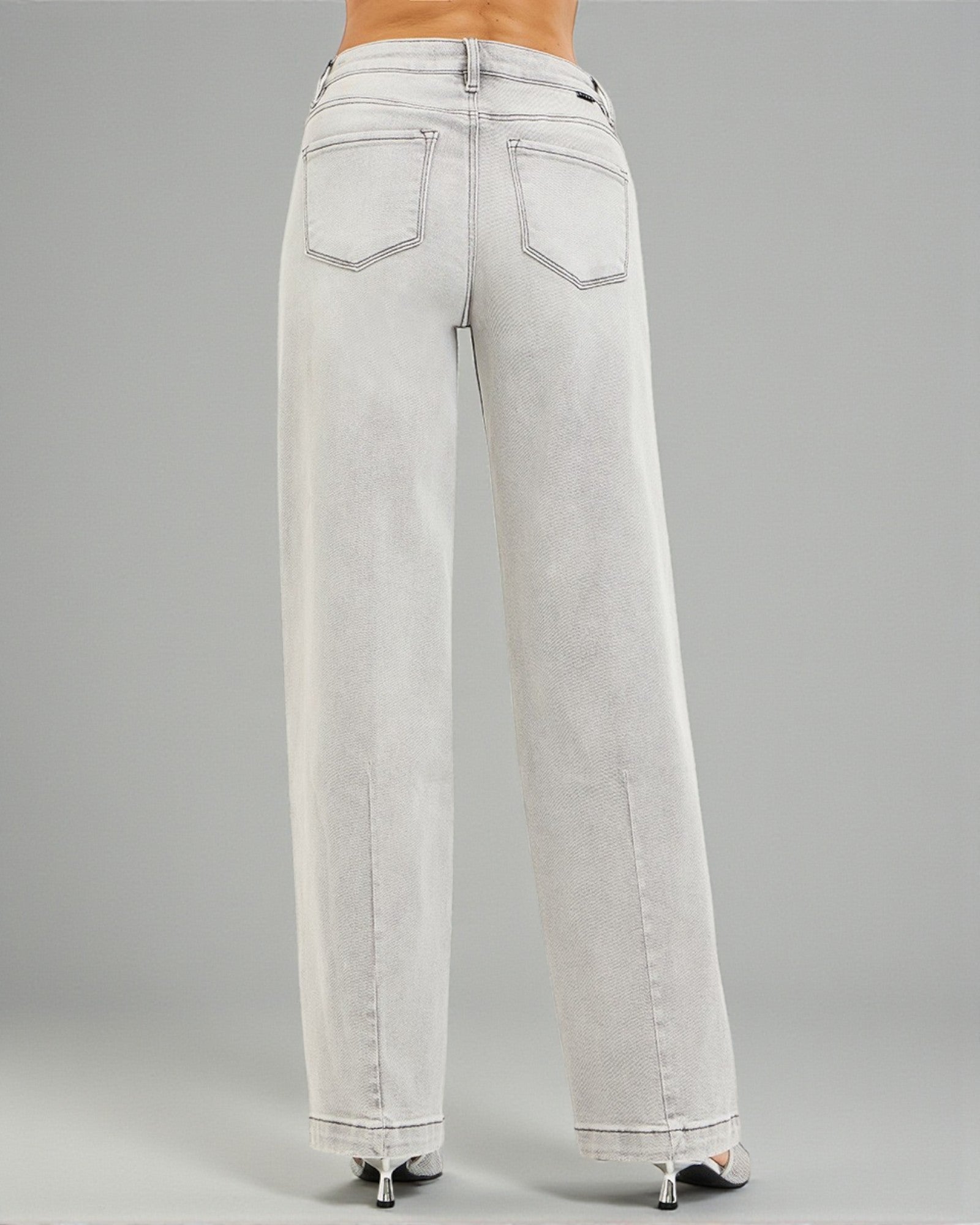 Light gray wide-leg jeans on a gray background