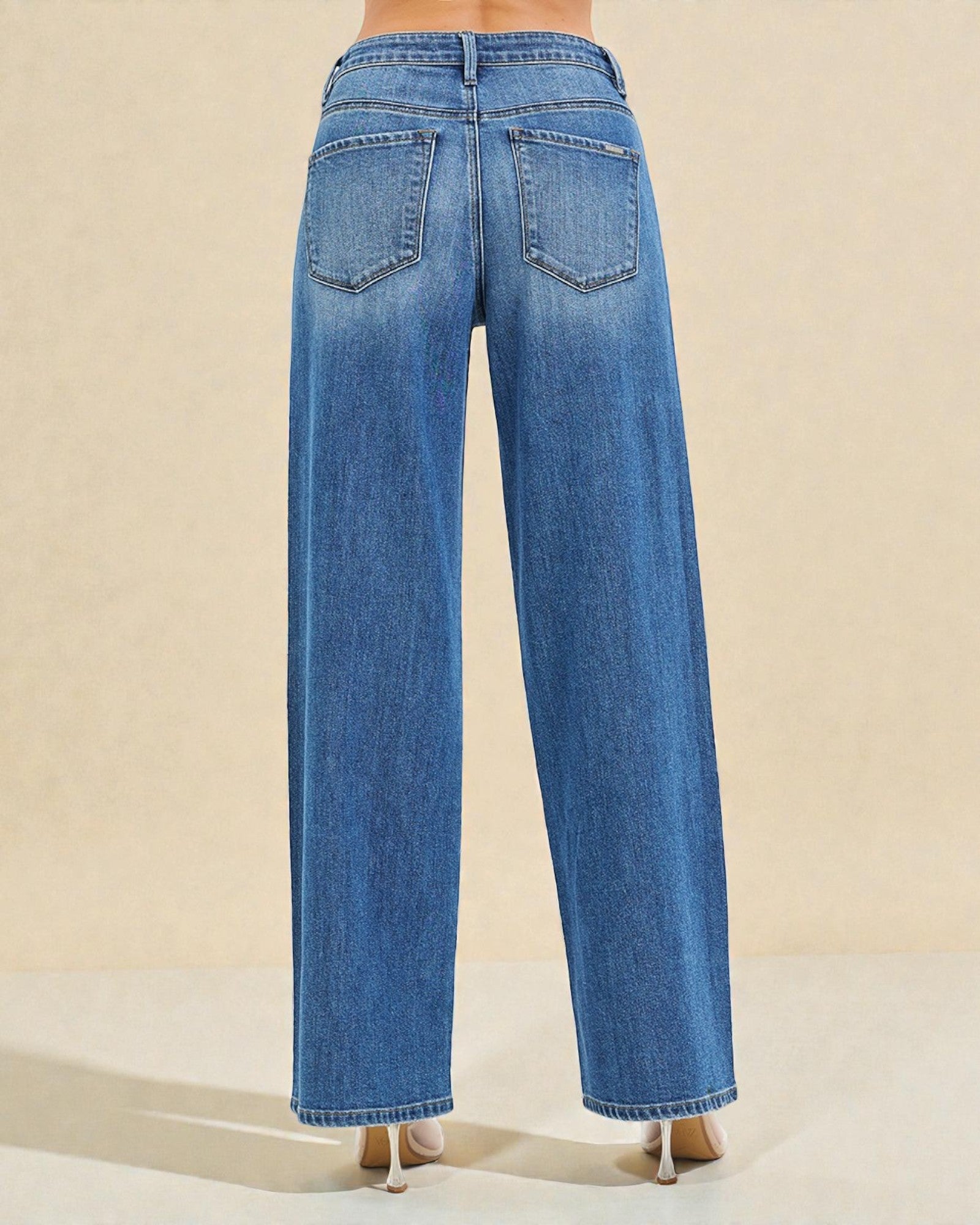 Blue jeans on a beige background