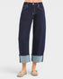 Navy blue wide-leg jeans with cuffed hem on a white background