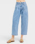 Light blue jeans worn by a person on a white background