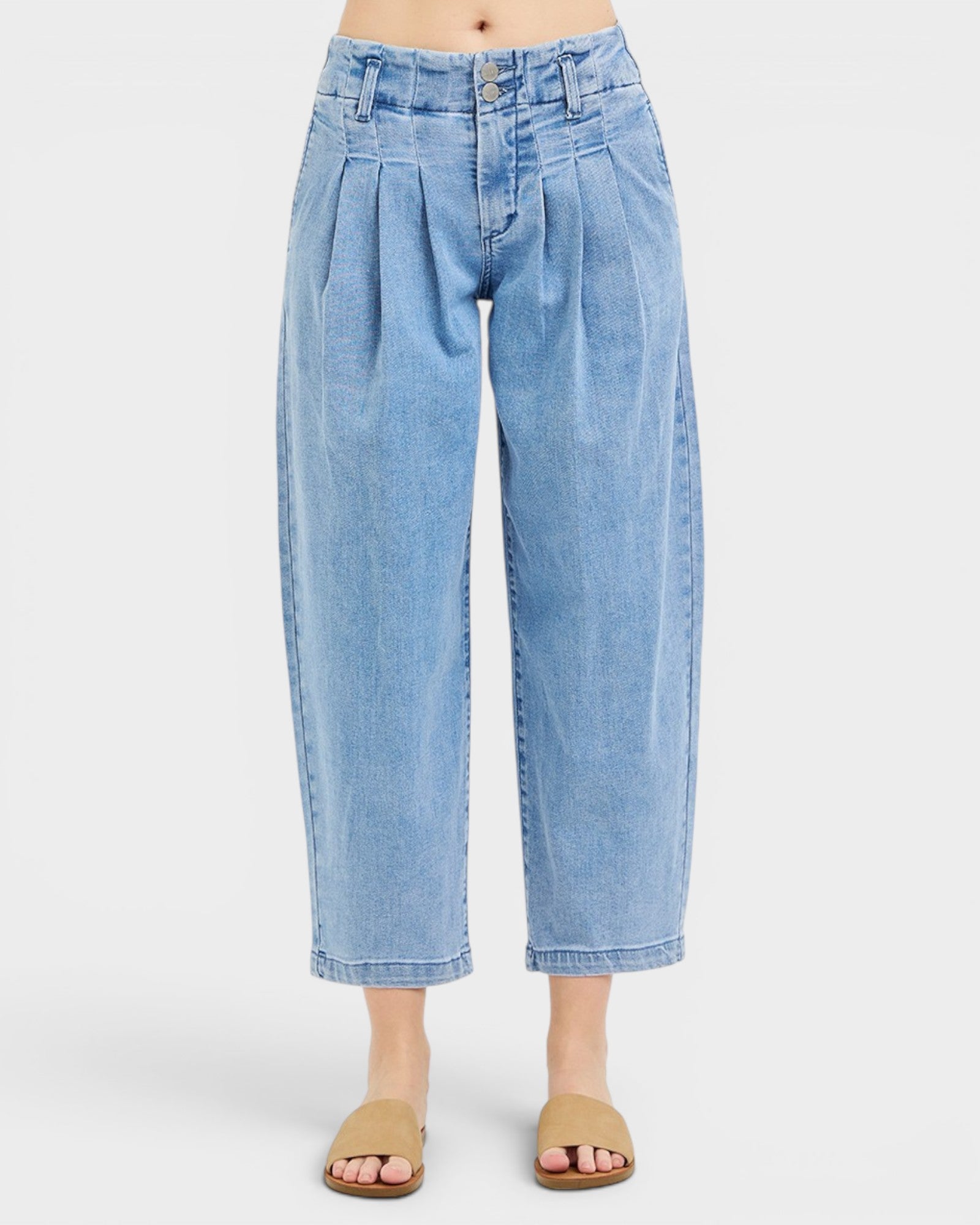 Light blue jeans worn by a person on a white background