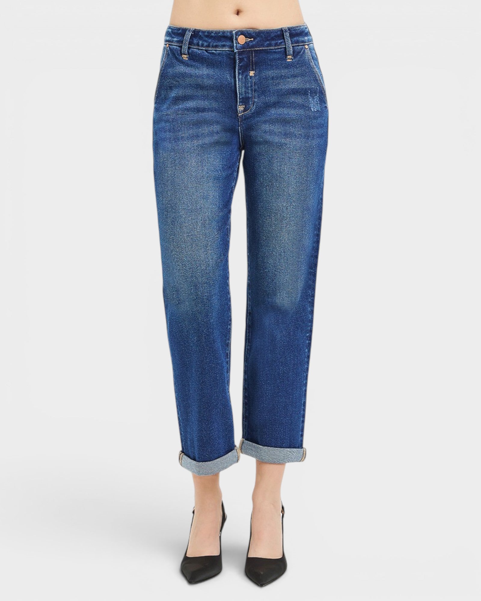 Blue jeans worn by a person on a white background