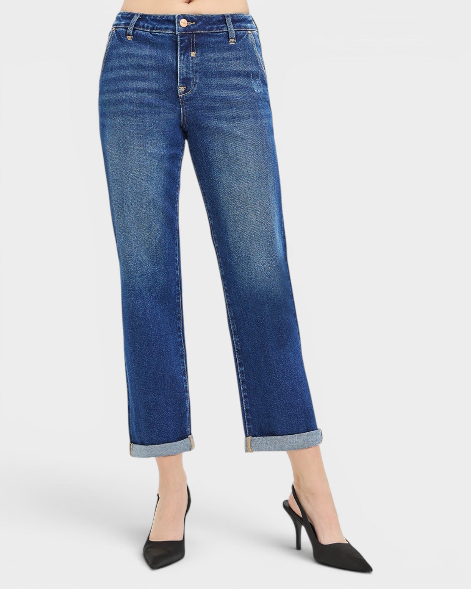 Blue jeans worn by a person on a white background