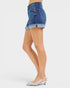 Denim shorts worn by a person on a white background