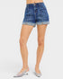 Denim shorts worn by a person on a white background