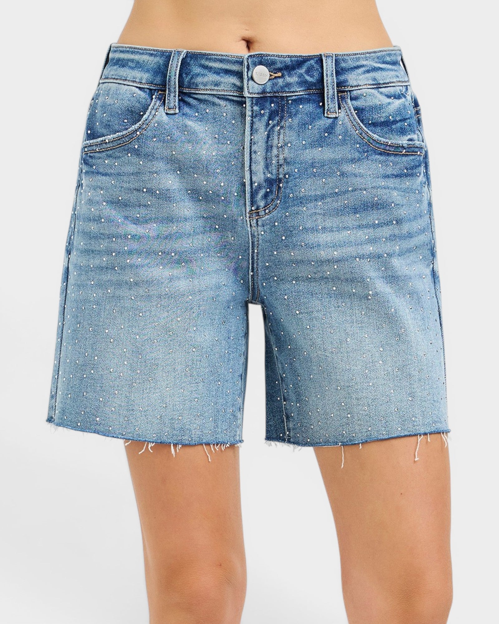 Blue denim shorts on a white background