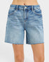 Blue denim shorts on a white background
