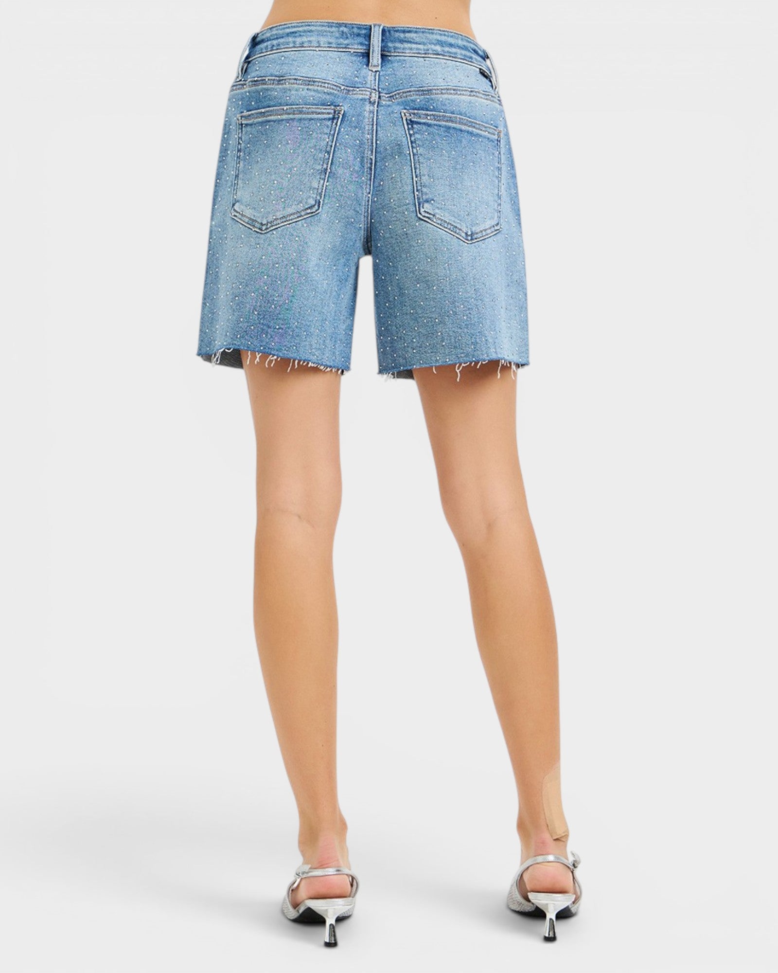 Light blue denim shorts on a white background