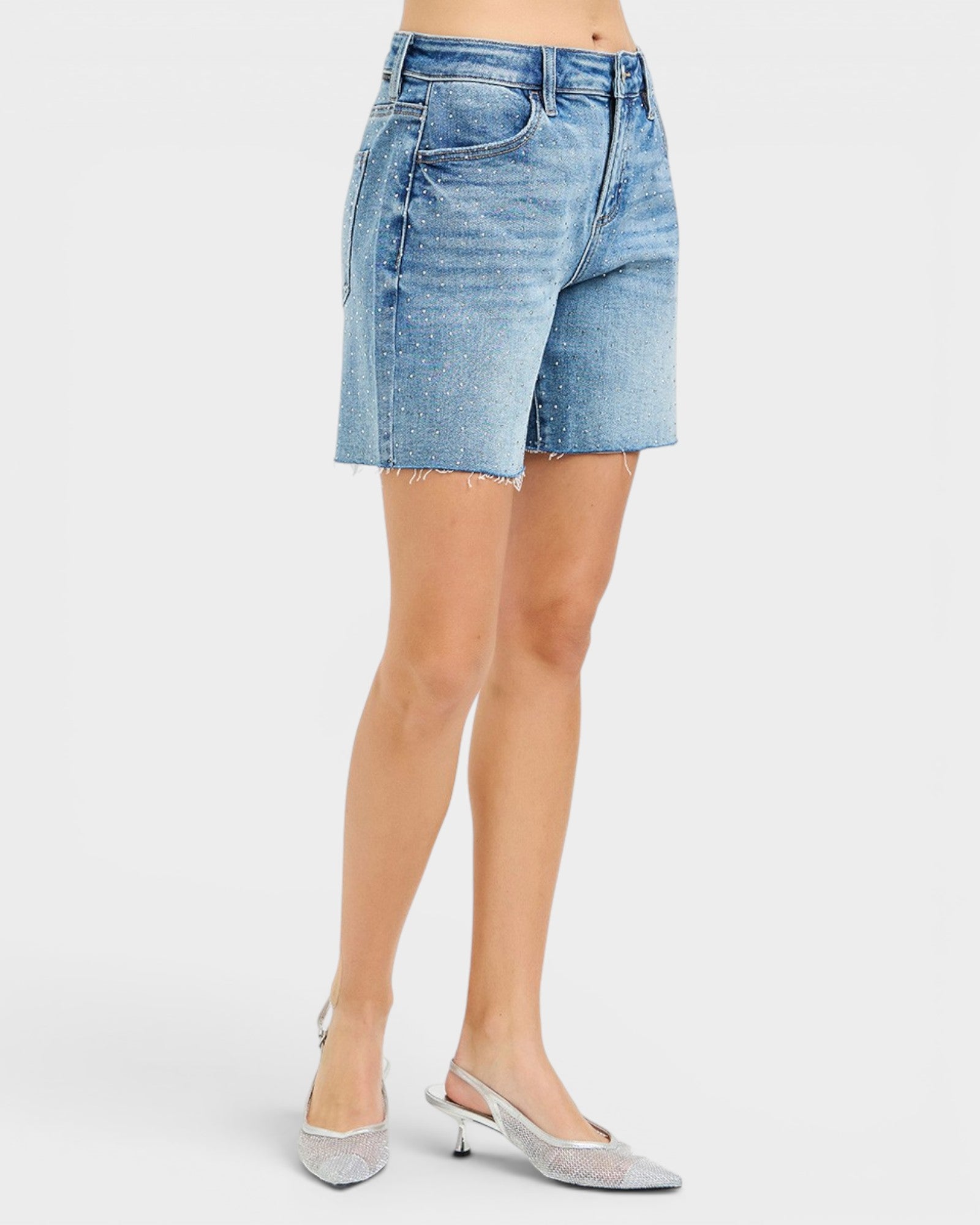Denim skirt worn by a person on a white background
